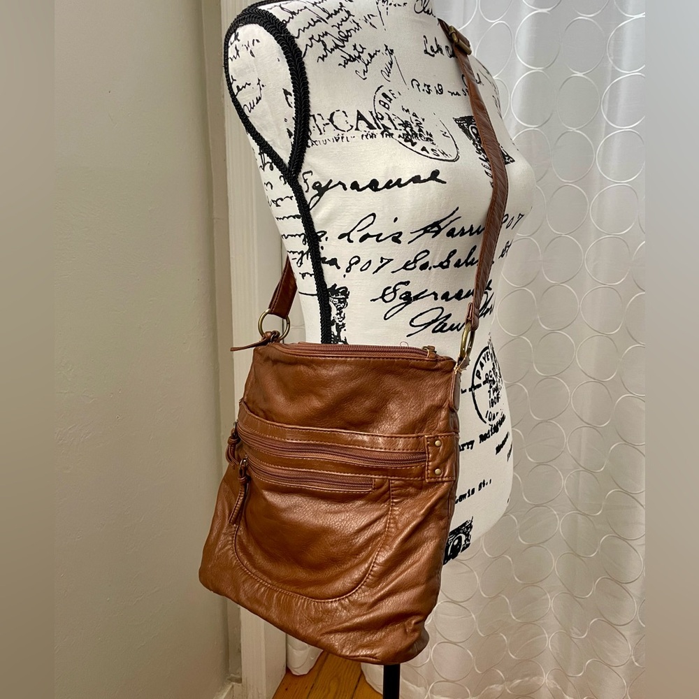 Brown crossbody bag with tons of zipper pockets